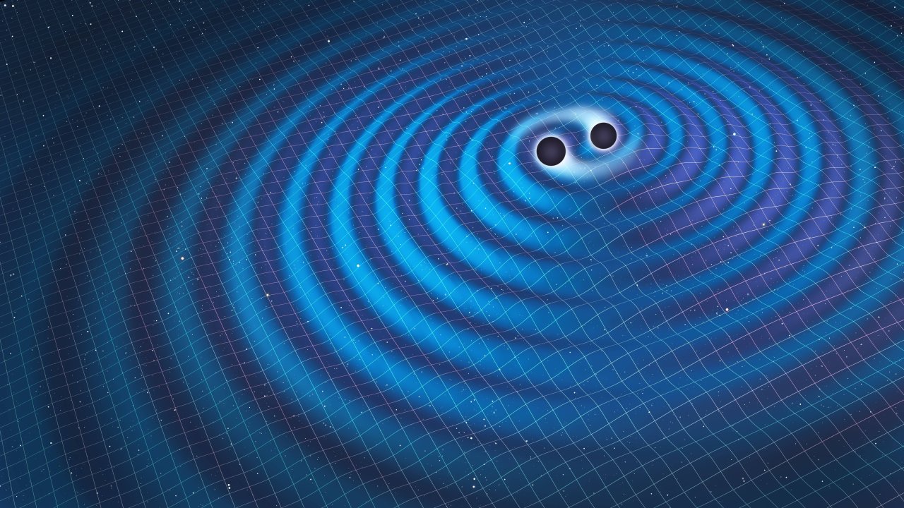 Wenn zwei massereiche Objekte wie Schwarze Löcher einander umkreisen oder zusammenstoßen, entstehen Gravitationswellen. 