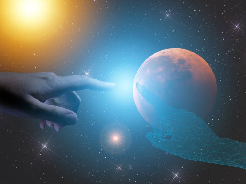 Ein menschliche Hand und eine außerirdische Hand treffen sich.