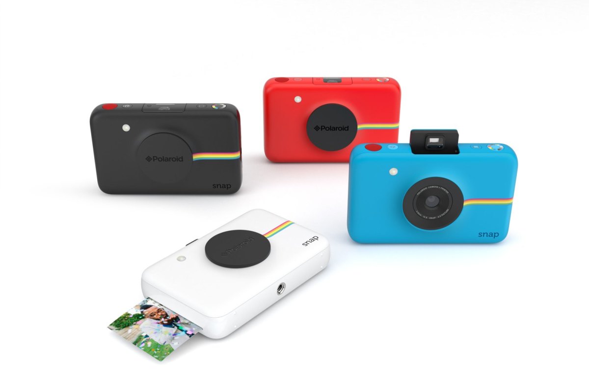 Vier Polaroid Snap-Kameras in verschiedenen Farben.