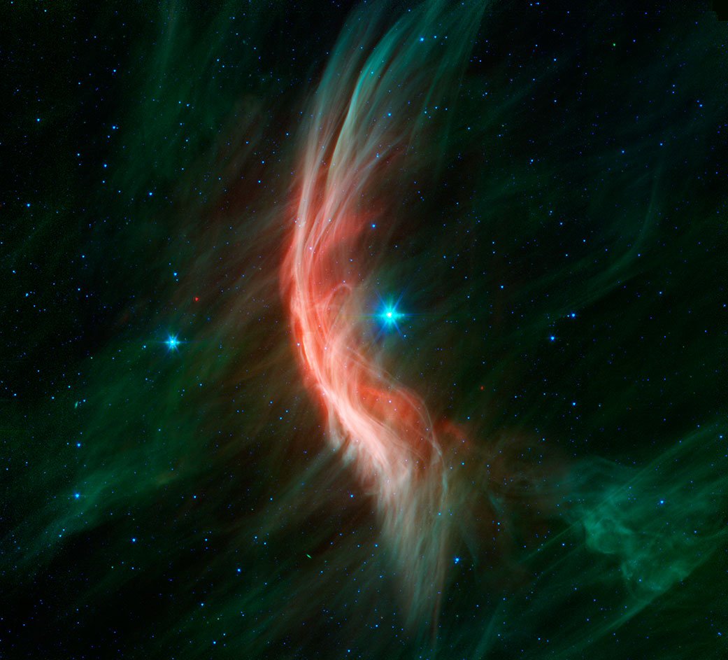 Der Riesenstern Zeta Ophiuchi und sein Bogenschock beziehungsweise seine Schockwellen.