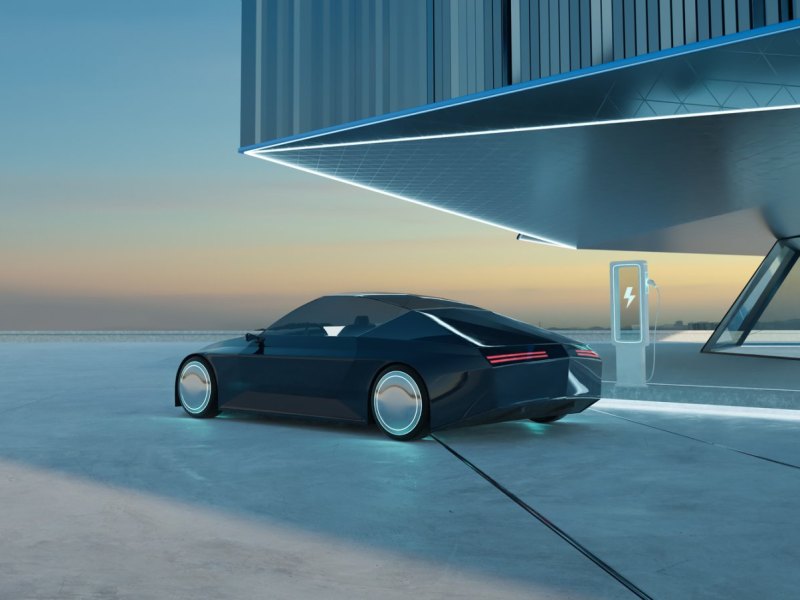 Markenloses Elektroauto-Konzept vor einem Gebäude