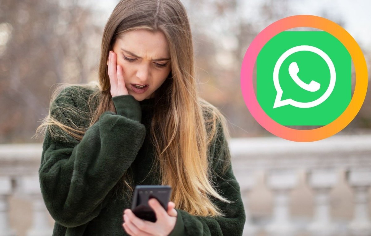 Frau schaut schockiert auf ihr Handy