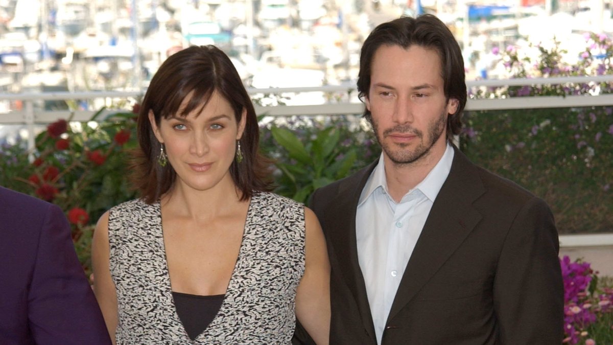 Keanu Reeves mit Carrie-Anne Moss in Cannes.. © Paul Smith/Featureflash/ImageCollect