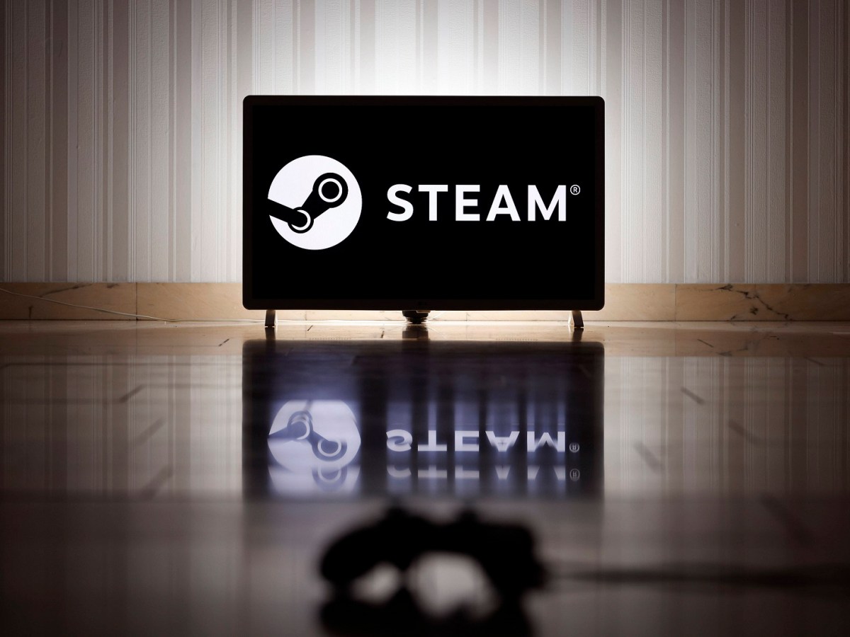 Das Logo der Internet-Spieleplattform Steam auf einem Bildschirm, im Vordergrund ein Gaming-Controller. Steam ist eine I