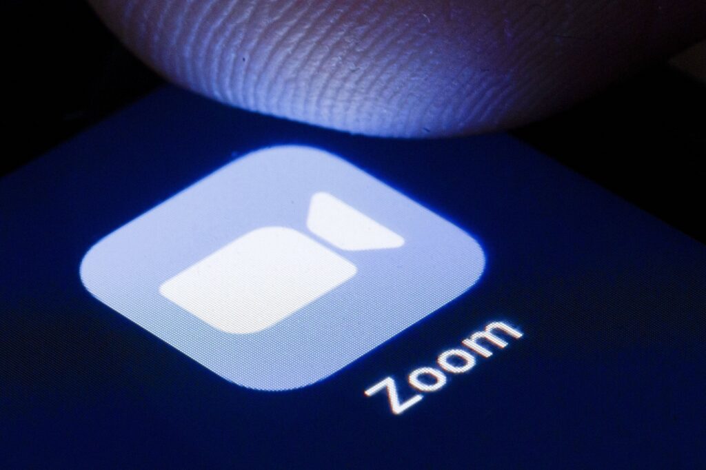 Zoom App Icon mit Finger