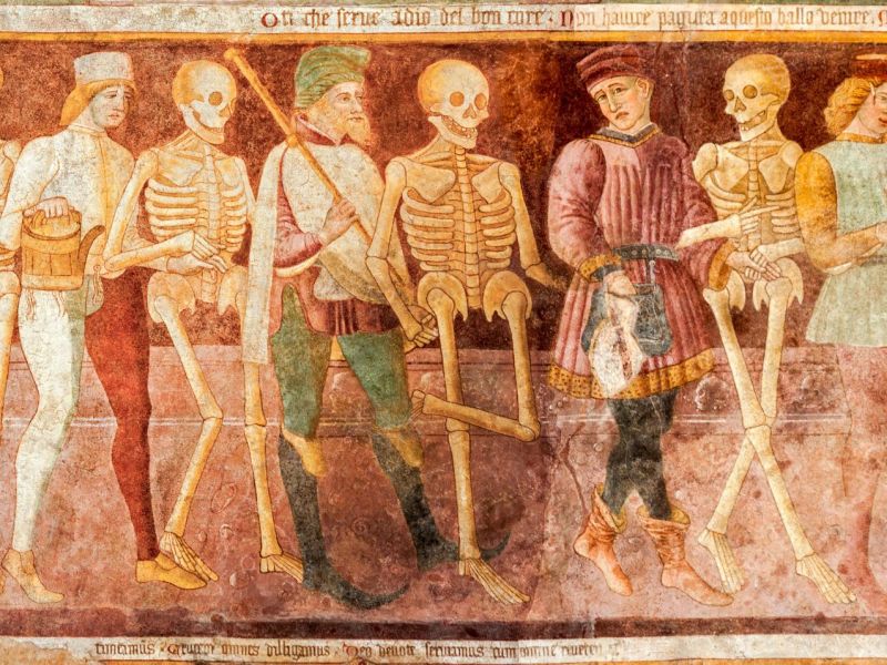 Abbildung zeigt Menschen und Skelette im "Tanz mit dem Tod"