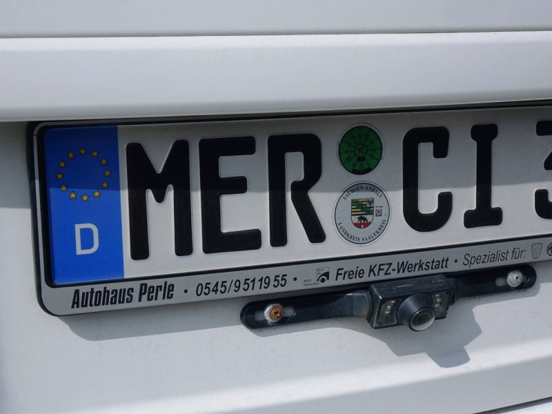 Nummernschild/Auto-Kennzeichen mit der Aufschrift Merci 3