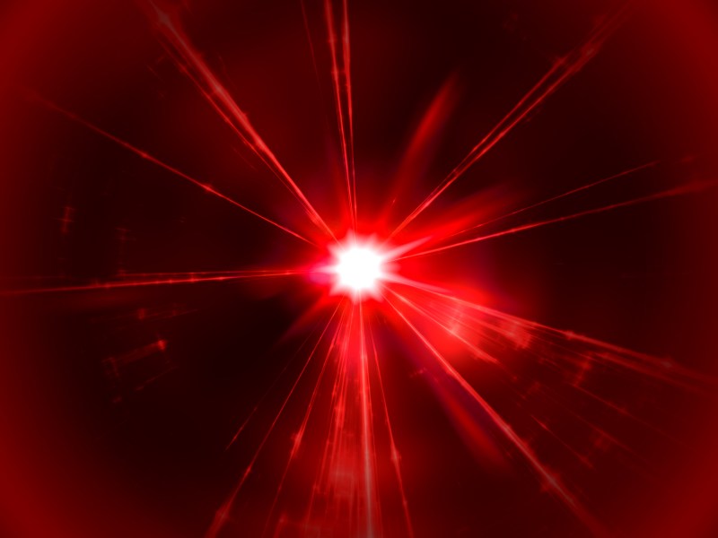 Ein roter Laser im schwarzen Raum